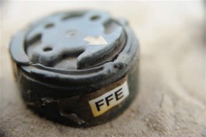 A small mine, known as a “toepopper”, designed to blow a foot off. FFE is the acronym for ‘free from explosive’