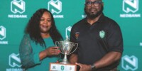 WHAT IT’S ALL ABOUT . . . Zimbabwe Junior Sables coach Shaun De Souza (right) poses with the Nedbank Rugby Challenge Cup trophy, alongside Nedbank Zimbabwe’s head of treasury, marketing and corporate affairs Latifa Kassim